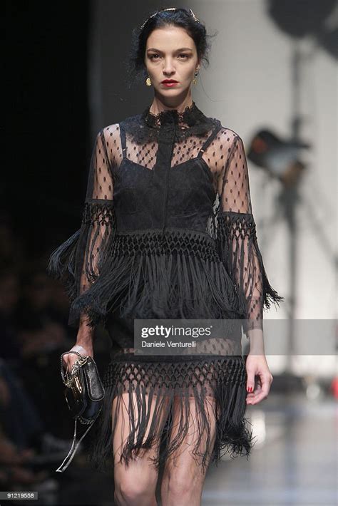 Model Mariacarla Boscono walks down the catwalk during the 